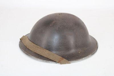 a helmet that is sitting on a white surface