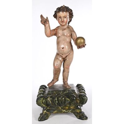 an image of a statue of a child holding a ball