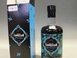 the bottle is next to the box on the table