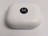 a close up of a white motorola phone on a table