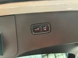 a close up of a car ' s dashboard with a remote control
