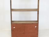 an image of a small wooden shelf with a drawer underneath it