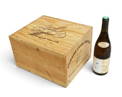 a wooden box with a bottle of wine next to it