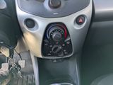 a car dashboard with a control panel and a steering wheel