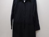 black shirt and shorts on a hanger next to a pair of shoes