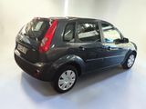 a picture of a small black car parked in a garage