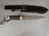 two knives that are laying next to each other on a table