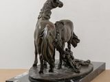 statue of a horse and a man with a dog on a marble base