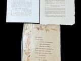a book with a poem on it sitting on a table