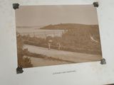 a picture of an old picture of a horse and buggy on the road