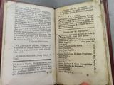 someone is holding a book open to a page with a picture on it