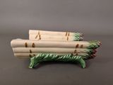 three asparagus spears on the table ready to be eaten