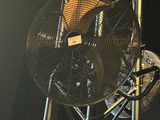 a fan that is sitting on top of a metal structure