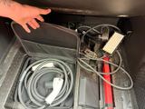 a hand that is holding a charger in a car