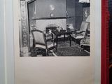 an open book with a black and white photo of a living room