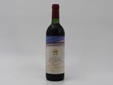 a bottle of wine that is sitting on a table
