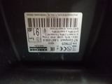 a bar code on the back of a car ' s hood