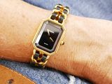 a woman that is wearing a watch on her wrist