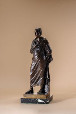 statue of a man with a cane standing on a marble base