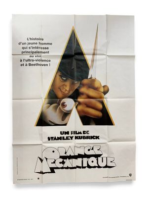 une affiche de film mettant en scène un homme tenant une paire de ciseaux