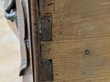 a close up of a piece of wood with a handle on it
