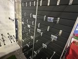 a lot of screws on the wall in the store