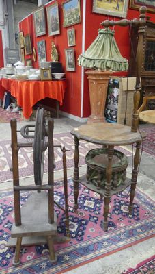 a table and chair in a room with a red wall