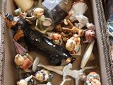 a box full of figurines sitting on a table