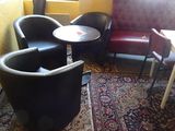 two chairs and a table in the corner of a room