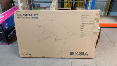 a cardboard box that is sitting on the ground in front of a building