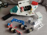 a small toy car and some other toys on a couch