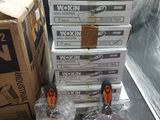 several boxes of workin tools sitting on top of a table