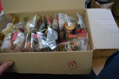 someone is holding a box full of different types of food
