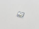 a square cut blue topazte stone on a white surface