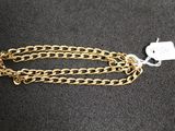 a close up of a gold chain with a tag on it