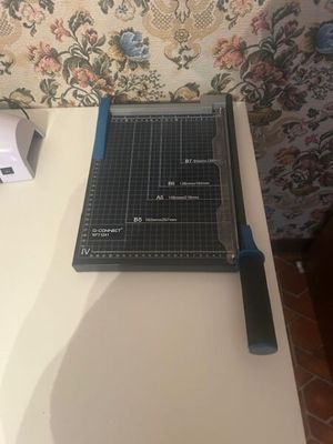 a cutting board and a pair of scissors on a table