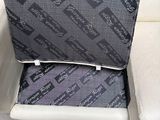 a white couch with a black and grey cover on it