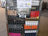 a metal cart with many boxes on it in a warehouse