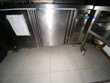 an image of a kitchen with a lot of stainless steel appliances