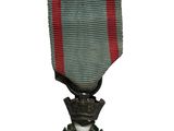 l'image d'une médaille surmontée d'une étoile