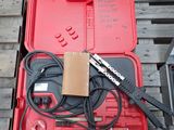 a red box with tools in it sitting on a pallet