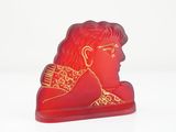 an image of a red glass figurine of a woman ' s head