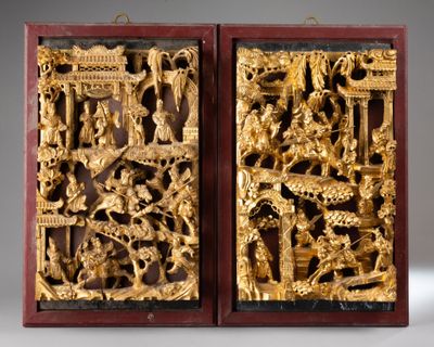 pair of chinese carved wood panels depicting scenes from the life of a man and woman