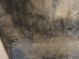 a picture of a black and white photo of a moldy wall