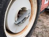 a close up of a tire on the side of a bus