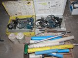 a box full of tools that are sitting on the floor