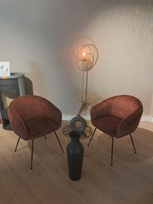 two chairs and a table in a living room