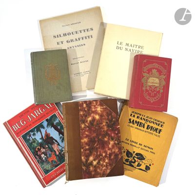 a lot of books that are sitting on a table