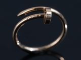 an image of a gold ring with a curved design