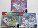 four different pokemon trading cards are displayed on a white surface